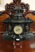 An impressive Victorian slate mantel timepiece with pendulum and key