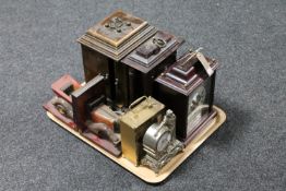 A tray containing wooden vintage car bookends, two jewellery boxes in the form of mantel clocks,