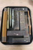 A collection of antique joiner's tools including brass mounted levels,