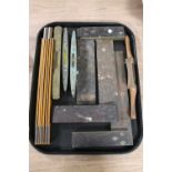 A collection of antique joiner's tools including brass mounted levels,