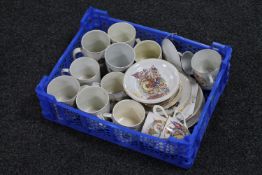A basket of a quantity of commemorative tea china