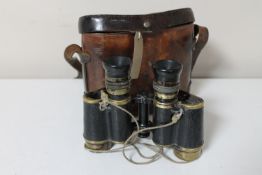 A pair of antique French Hunsicker & Alexis field glasses in leather case