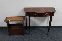 A mahogany serpentine fronted two drawer hall table together with a magazine rack