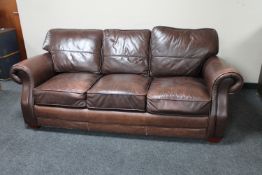 A Barker & Stonehouse brown leather three seater settee