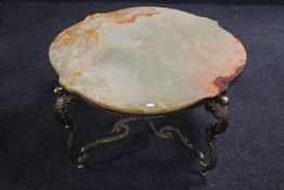 A shaped onyx coffee table on brass base