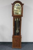 A reproduction mahogany longcase clock with brass moonphase dial