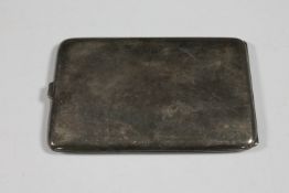 A silver cigarette case,