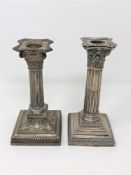 Two Victorian silver Corinthian column candlesticks,