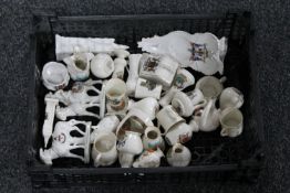 A basket of a quantity of antique tourist china