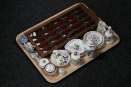 A display case containing metal and china thimbles,