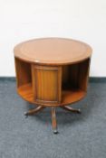 A circular Victorian style mahogany leather topped drum table