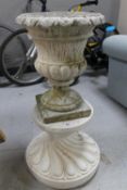 A composition garden urn on stand