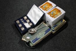 A tray containing boxed and cased cutlery, cased napkin rings,