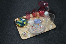 A tray of assorted glass ware including three Victorian cranberry glass jugs, glass perfume bottles,
