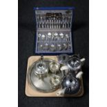 A tray of canteen of plated cutlery, three piece plated Yeoman Plate tea service on tray,