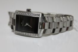 A Movado diamond set stainless steel wristwatch, set with approximately 1 carat of diamonds,