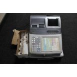 A Casio T-800F electronic cash register (no keys) and a box of till rolls