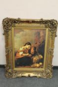 An ornately framed picture depicting two young girls,