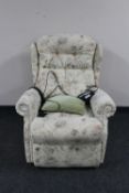 A Celebrity electric reclining armchair upholstered in a green button fabric