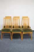 A set of six late 20th century teak rail back dining chairs