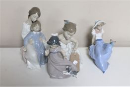 Four Nao figures - mother with child, baby,