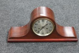 An early 20th century mahogany mantel clock with silvered dial