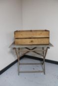 A folding teak garden table and a Jaffa wooden crate