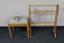 An oak tapestry upholstered dressing table stool together with a barley twist towel rail