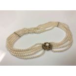 A cultured pearl five stranded collar on 9ct gold clasp,