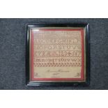 A late 19th century continental alphabet sampler by Anna Nielsen dated 1887 CONDITION