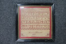 A late 19th century continental alphabet sampler by Anna Nielsen dated 1887 CONDITION