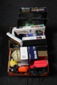 Two boxes containing Star Wars collectables including Monopoly, books, tazo's etc,