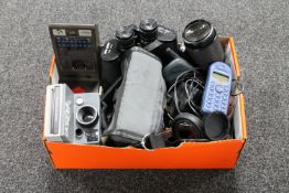 A box containing Zenith field glasses, cameras, vintage mobile phones,