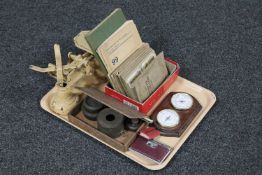 A tray of wooden cigar box, vintage scales with weights, cigarette card albums,