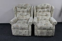 A pair of armchairs upholstered in a cream floral buttoned fabric