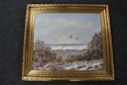 A 20th century gilt framed oil on canvas, signed N K Niels - ducks in flight,