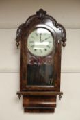 A continental walnut wall clock,