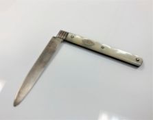 A large Georgian silver and mother of pearl fruit knife CONDITION REPORT: 6.