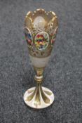 A Victorian gilded enamel vase with six floral panels,