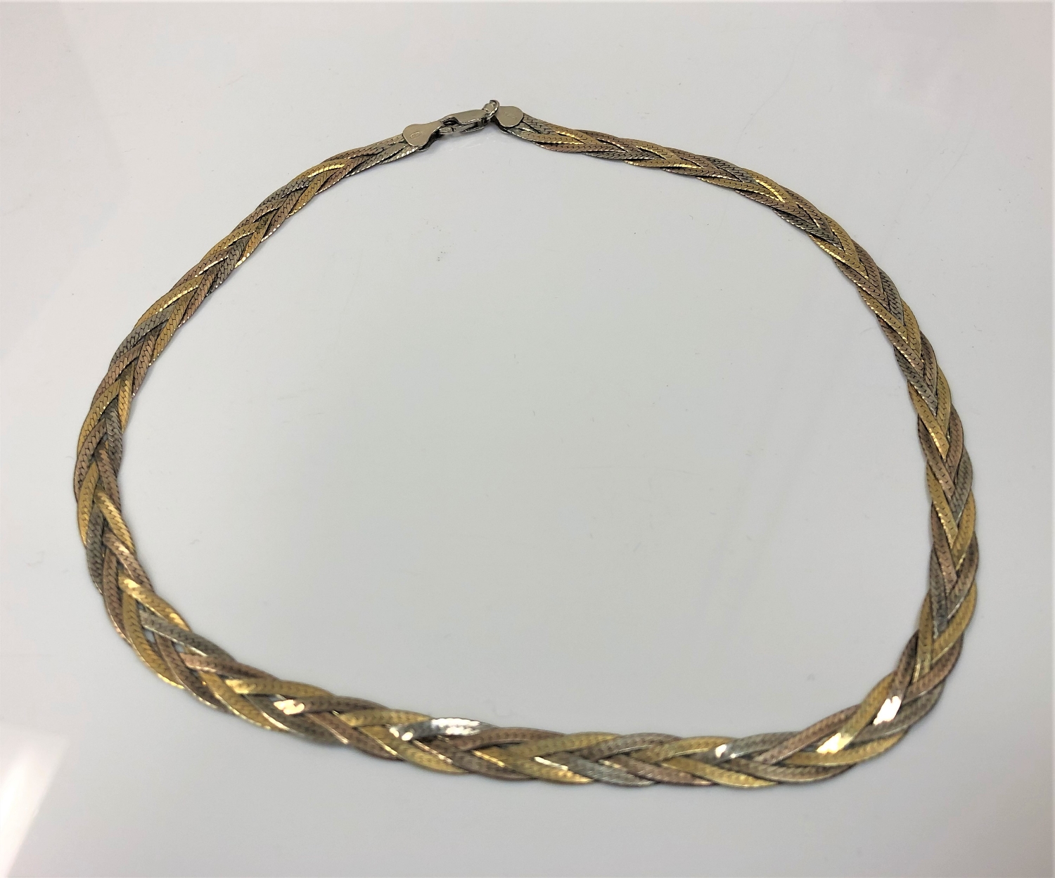 A three tone flat linked necklace, the bale stamped 925, 13.5g.