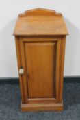 An Edwardian satinwood pot cupboard