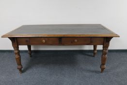 A Victorian pine library table fitted two drawers