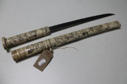 A Japanese tanto knife with carved bone handle and sheath