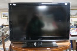 A Samsung 37" LCD TV with remote