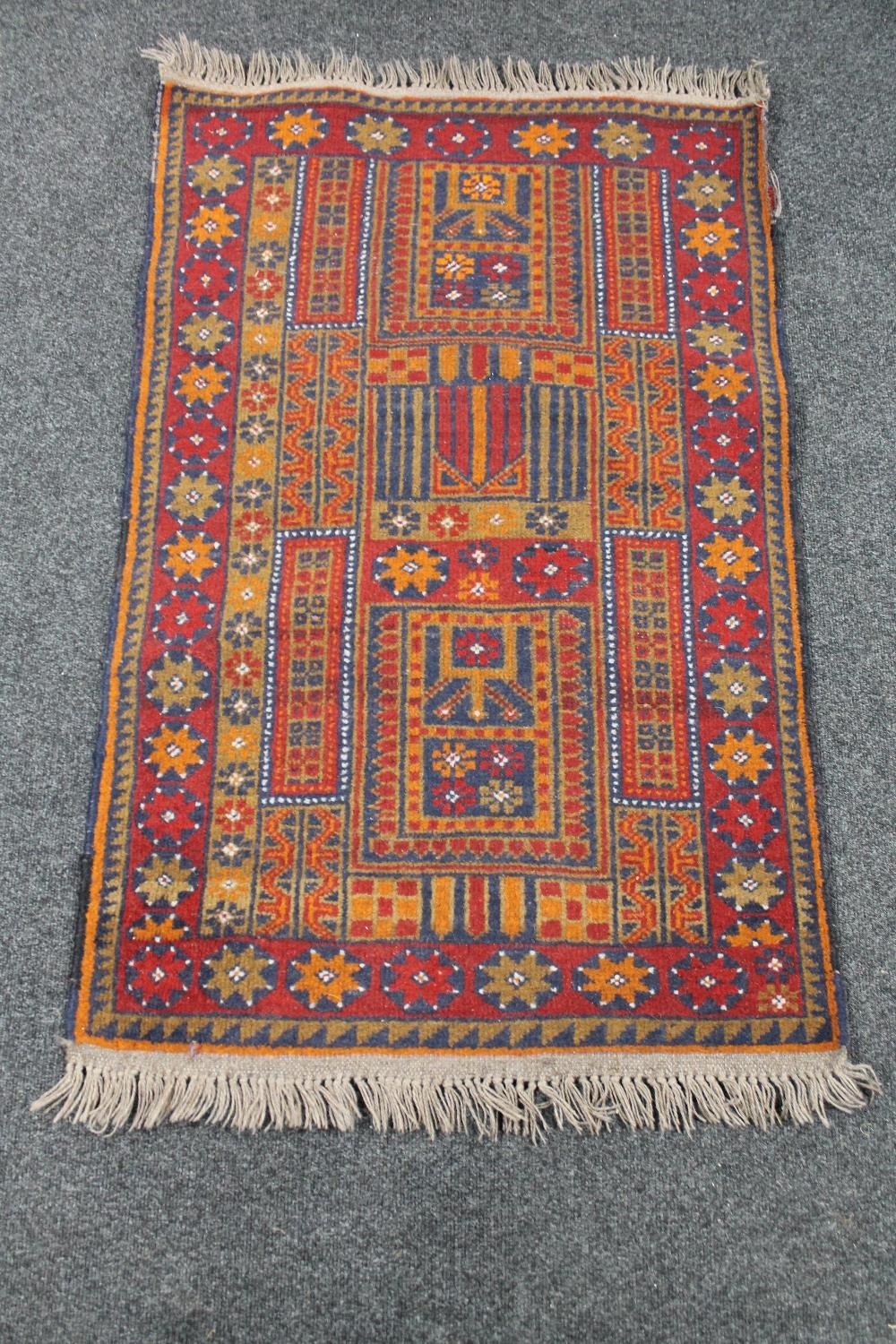 An Afghan rug 137 cm x 78 cm
