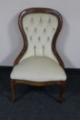 A Victorian style lady's chair in cream button dralon