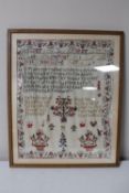 An antique oak framed sampler