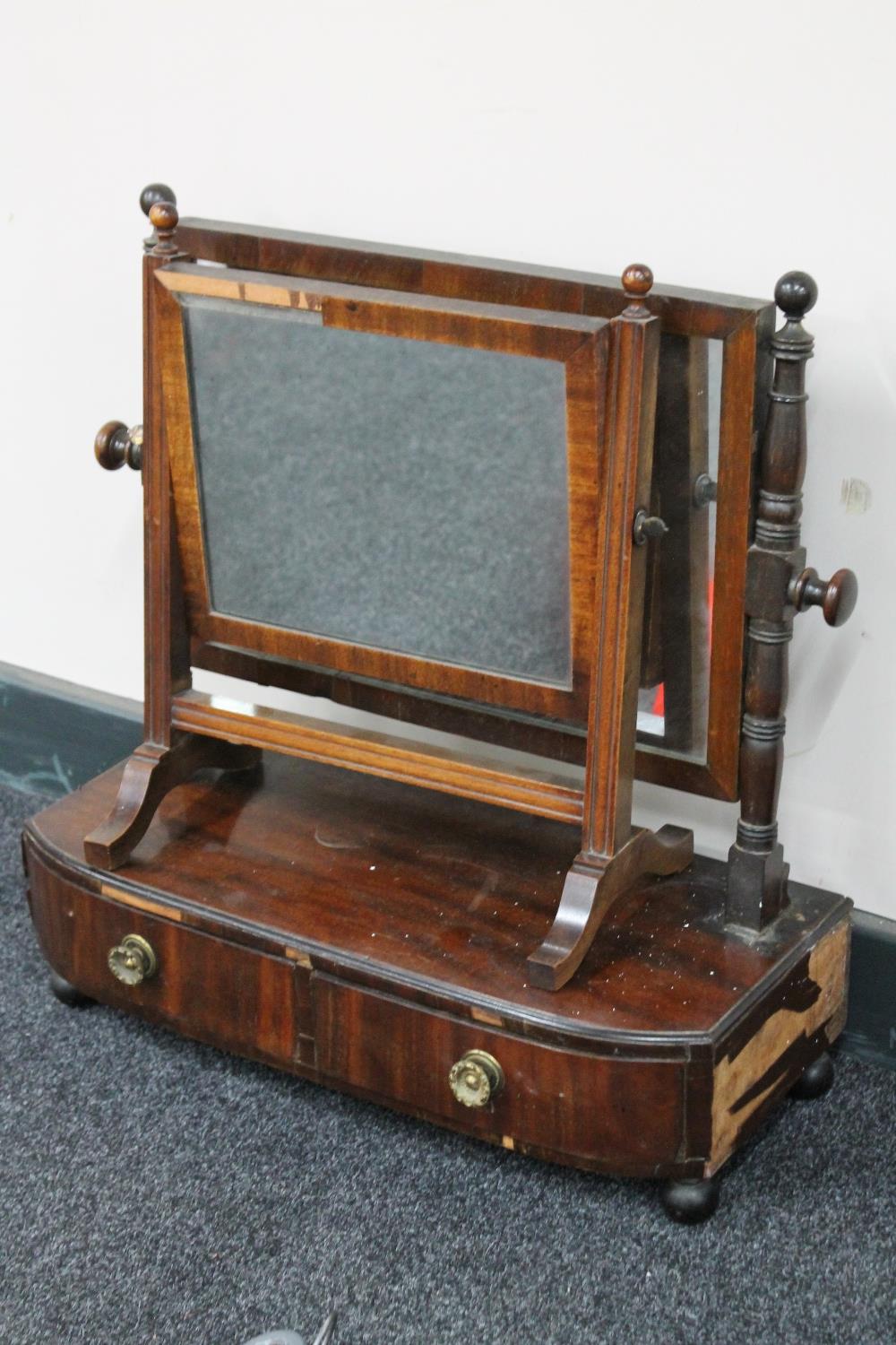 A Victorian mahogany toilet mirror fitted two drawers together with a mahogany dressing table