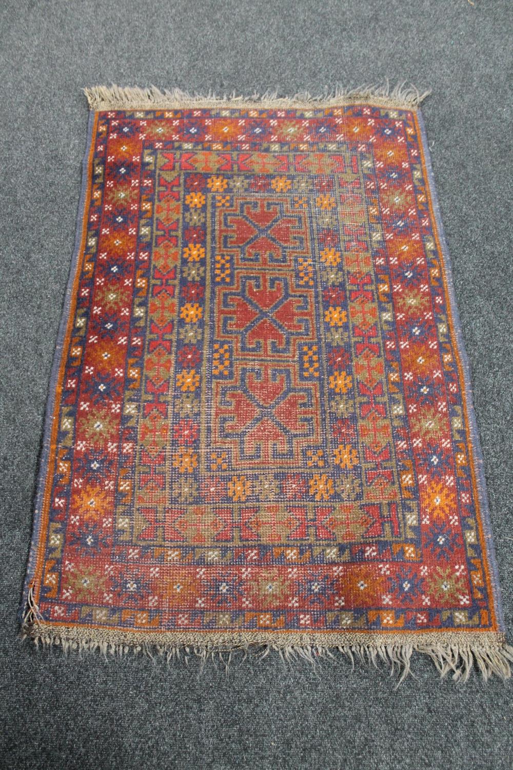 An Afghan rug 137 cm x 86 cm