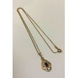 A 9ct gold diamond and amethyst set pendant on 9ct gold chain, 3.7g.